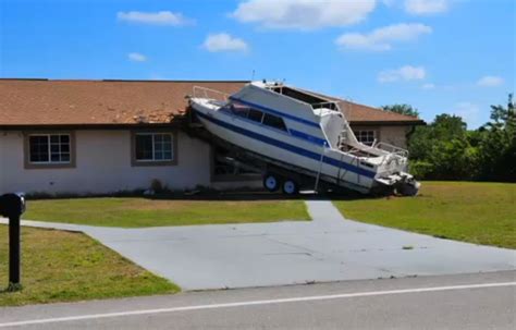 boat crashes into house